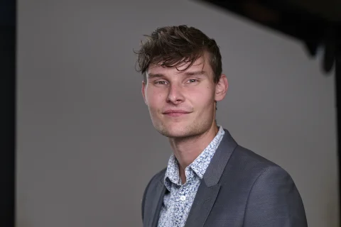 Matthew Malan, photographed in a relaxed studio portrait.